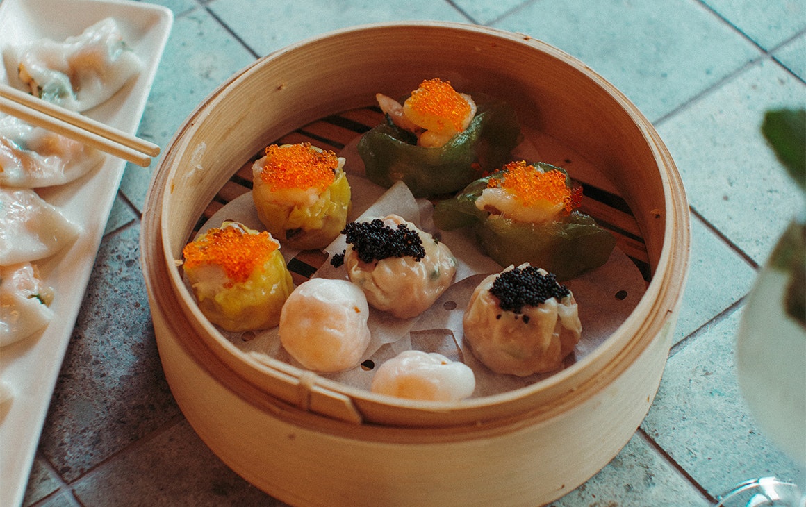 a bamboo basket of dumplings